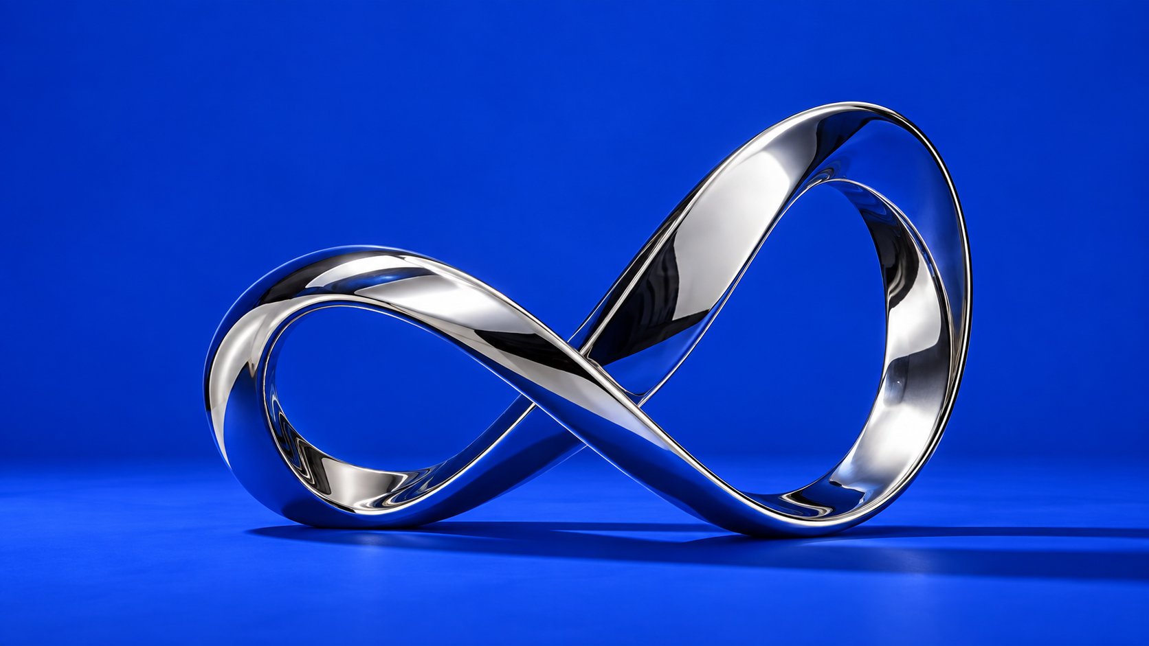 Sculptural chrome loop on a vivid blue background